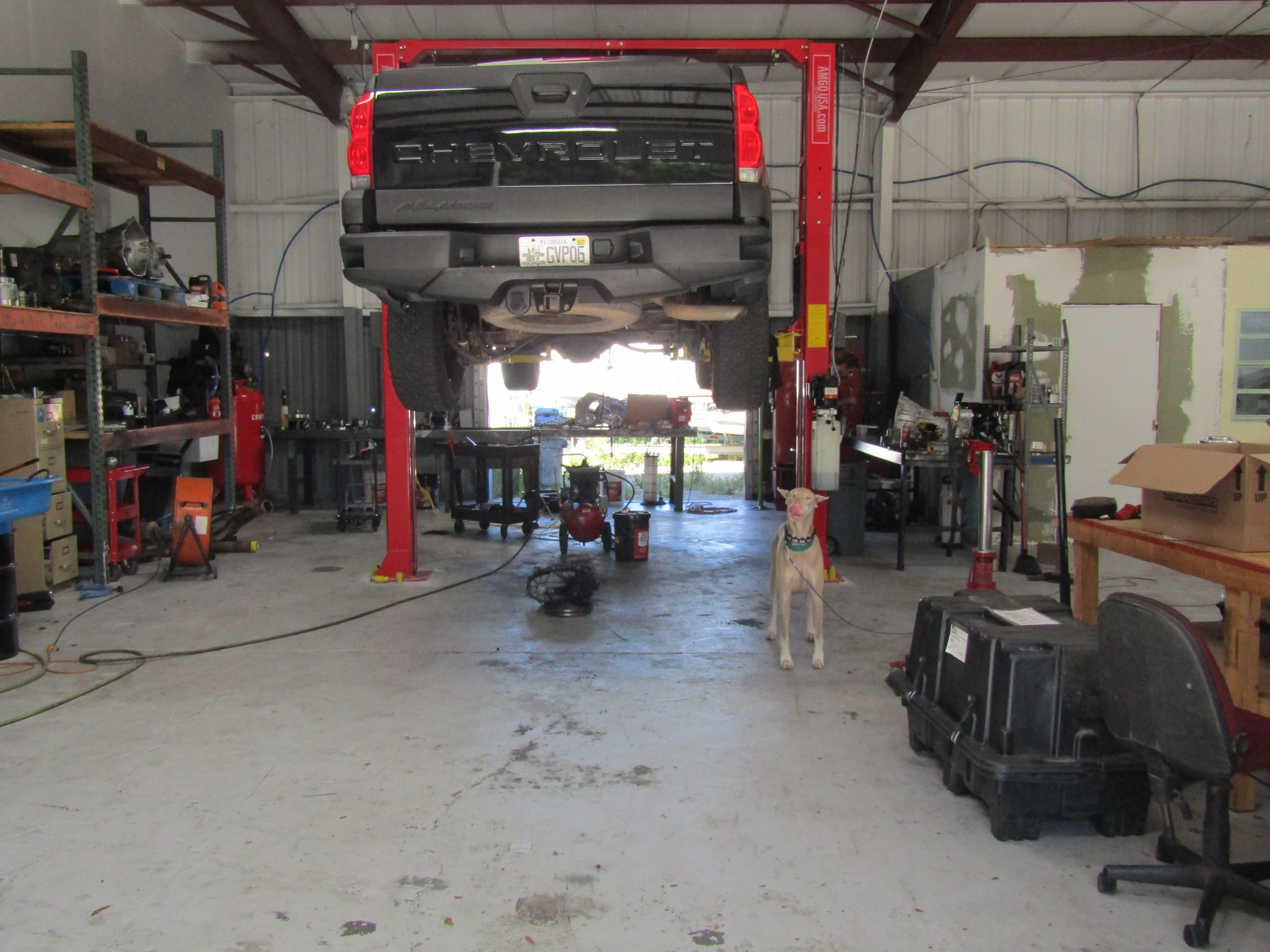 Truck on lift inside Shift Right Transmissions shop