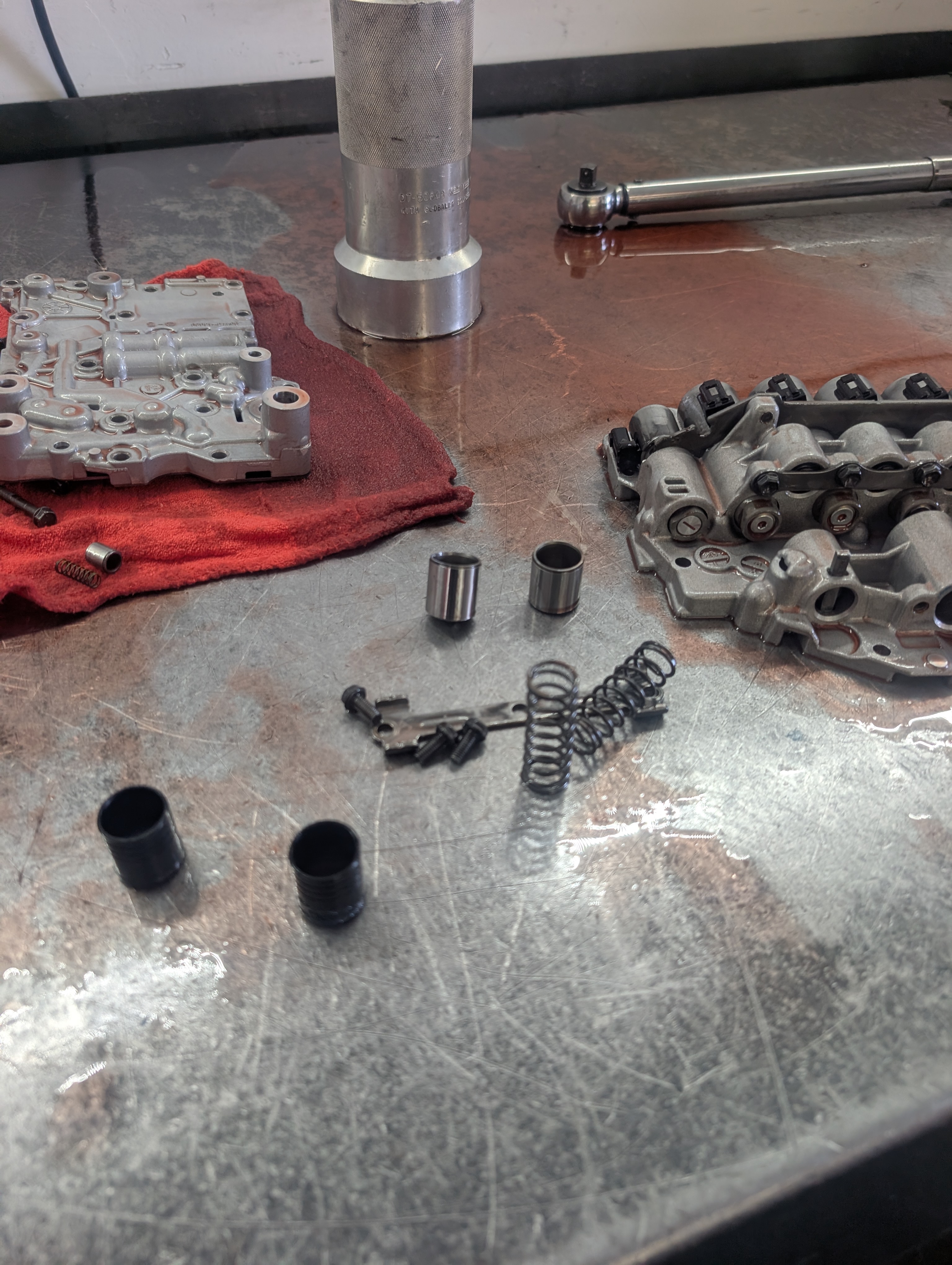 Transmission components laid out at the Shift Right Transmissions shop