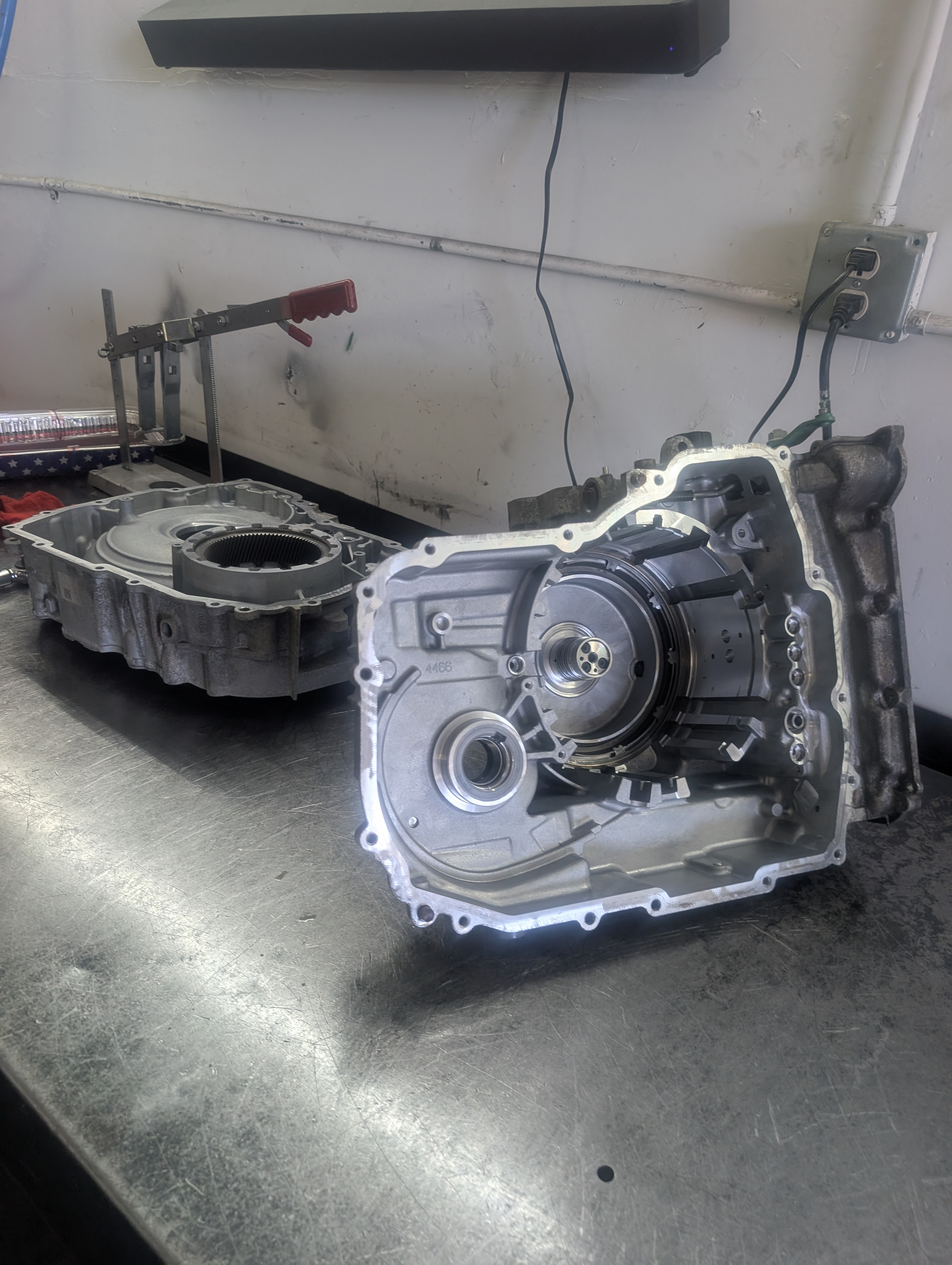Transmission parts laid out on the workbench at Shift Right Transmissions